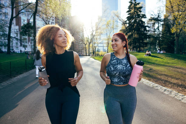 Two friends in their morning activity at the park, active lifestyle in Spring, New York, USA.